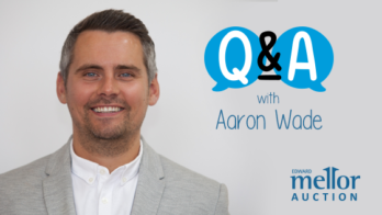 An image of a gentlemen with a grey blazer and white shirt with text 'q&a with aaron ward'